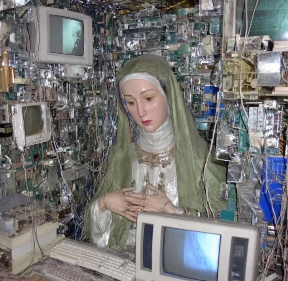 Mother Mary inside and surrounded by computers