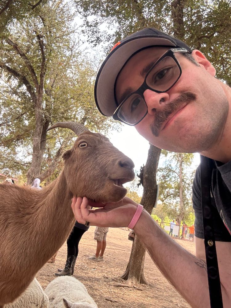 Pyreo giving a goat good chin scratches