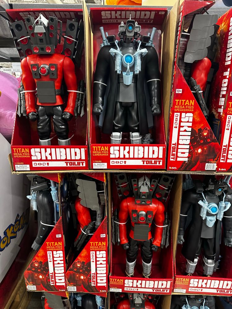 A stack of action figures being sold at Costco under the name “Skibidi Toilet”