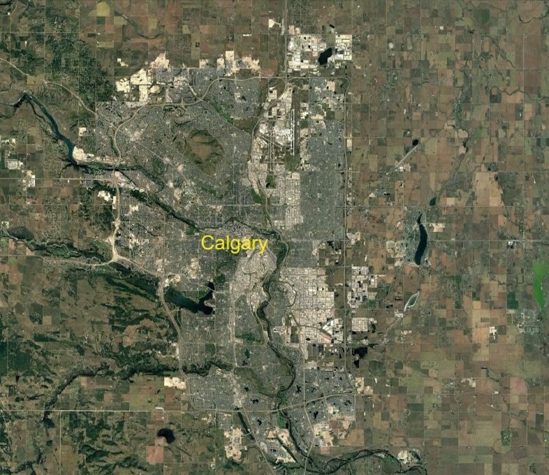 Satellite image of the City of Calgary with the word Calgary in yellow Arial font