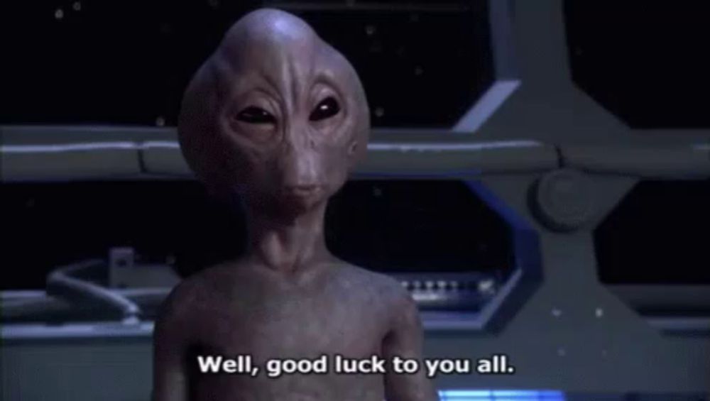 an alien without a shirt is standing in front of a space ship .