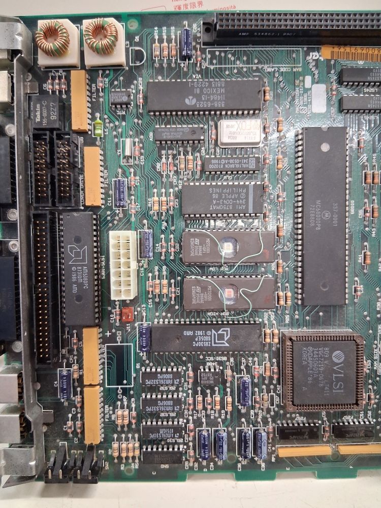 Macintosh SE motherboard with both BIOS chips and the SCSI Controller IC replaced to finish the repair.
