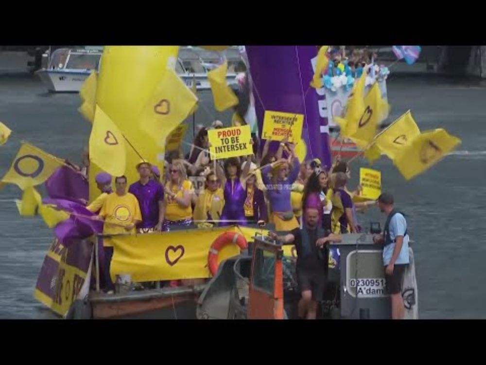 Thousands line Amsterdam's historic canals for colourful Canal Parade