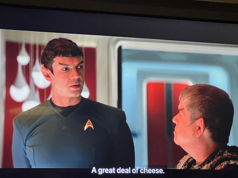 Spock, a white guy with pointed ears and eyebrows wearing a blue tunic, and Doug, fucking Doug, a much shorter Vulcan played by patton oswalt The caption says “a great deal of cheese”