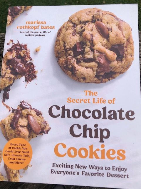Photograph of new cookbook from @marissarothkopf.bsky.social titled "The Secret Life of Chocolate Chipe Cookies" that will send you immediately to your kitchen. APRONS ON!!!