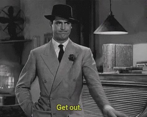 Cary Grant gesturing and demanding "Get out."