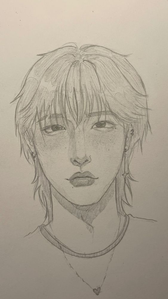 a sketch of a random oc, a guy with shoulder length hair, piercings, an eyebrow slit, and makeup (heavy blush under his eyes and freckles)