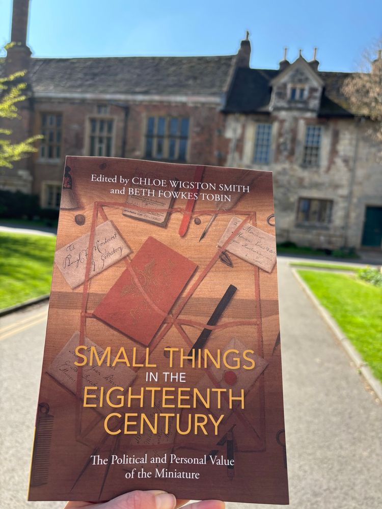 A paperback copy of Small Things in the Eighteenth Century in the sunshine in front of King’s Manor in York.