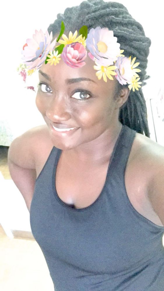 Women in black shirt with a Snapchat flower filter on her head