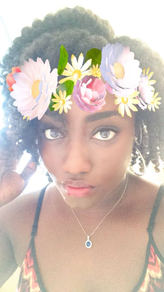 Women in with a Snapchat flower filter on her head