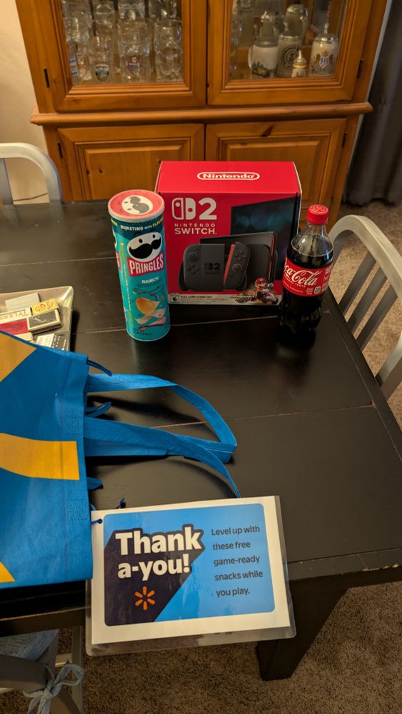 Switch 2 delivery with a tube of ranch Pringles and a bottle of coca cola that were included as a bonus perk
