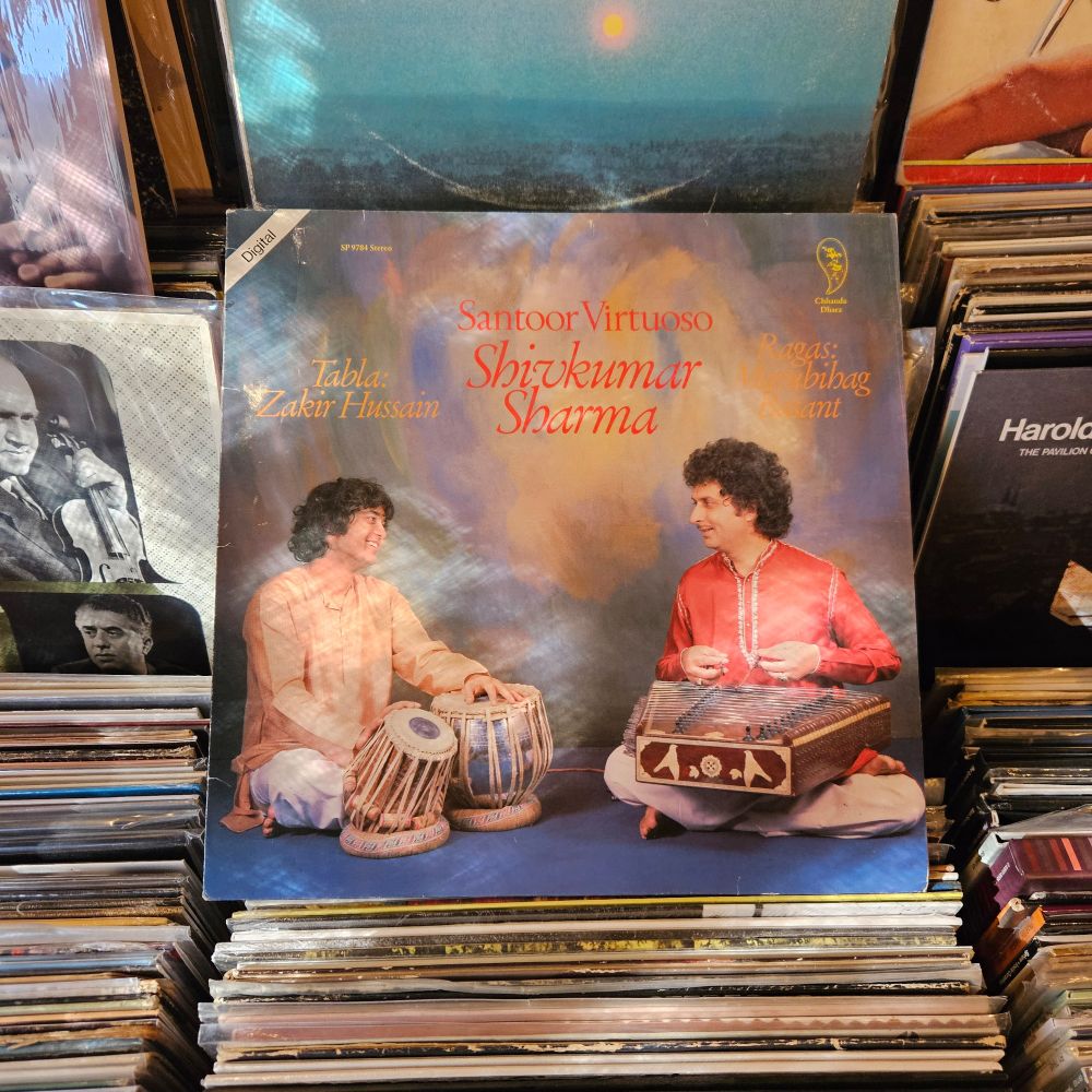 Album cover features a color photograph of Shivkumar Sharma and Zakir Hussain seated, with their respective instruments.