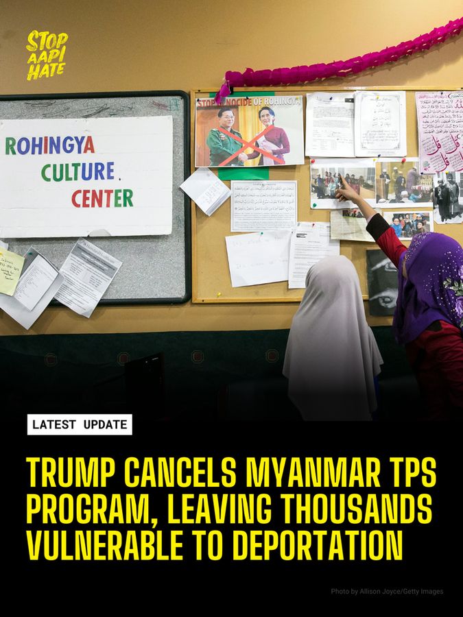 Children point at a bulletin board at a Rohingya Culture Center