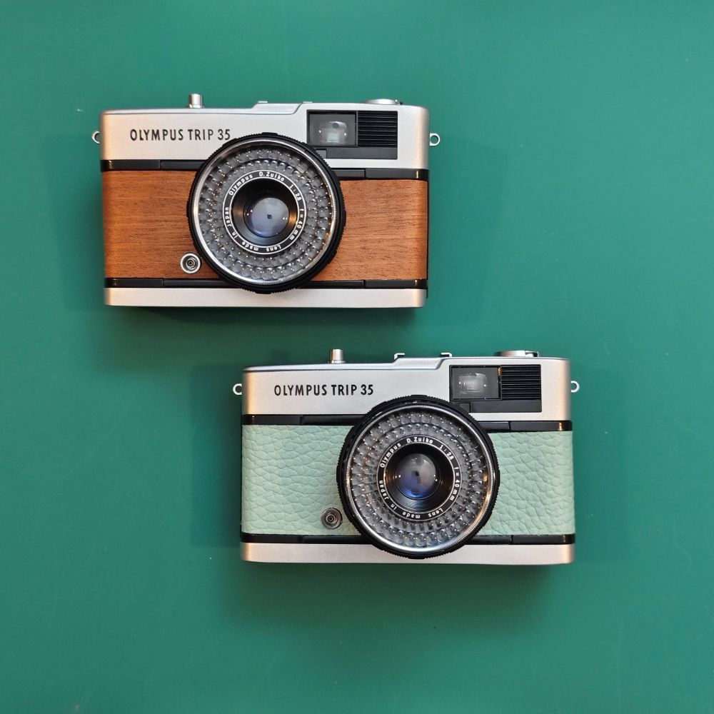 Cherry Mahogany wood finish and a Water Green leather style. 