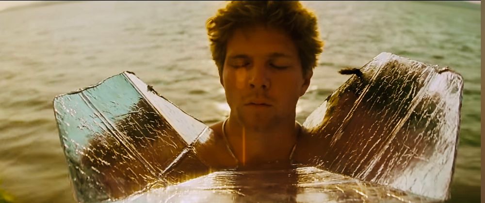 Sam Bottoms as Gunner's Mate 3rd Class Lance B. Johnson, a former professional surfer from Orange County, California.