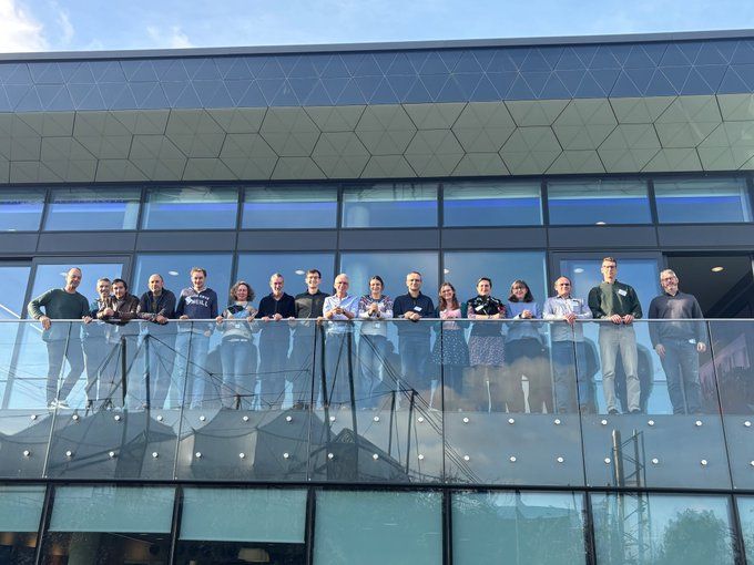 A group of scientists involved in the ExtAnt project standing on a balcony outside the Aurora building at BAS