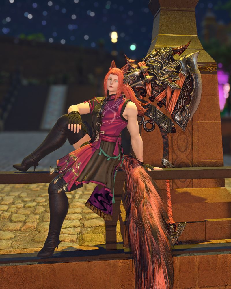 Kitsune sitting on a handrail looking off into the distance.