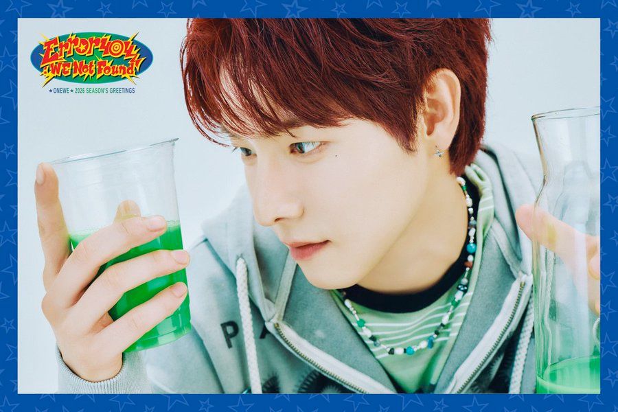 Closeup of Yonghoon looking intently at a cup of bright green liquid