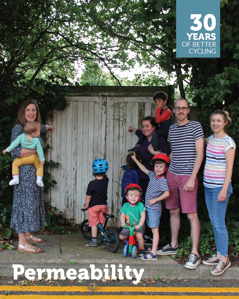 Families campaigning for a new walking and cycling link from the Westbrook Centre site. They stand by a fence where they'd like the route to go. Overlaid is a '30 years of better cycling logo' and the text 'Permeability'