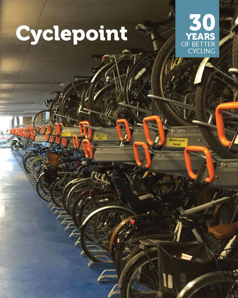 Picture of two-tier stands in the Cyclepoint cycle park. Overlaid is a '30 years of better cycling' logo and the text 'Cyclepoint'