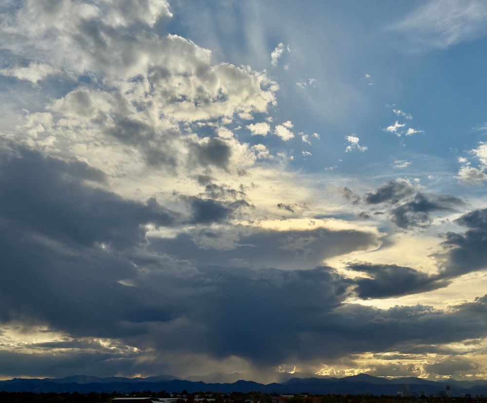 clouds, mountains and rain below