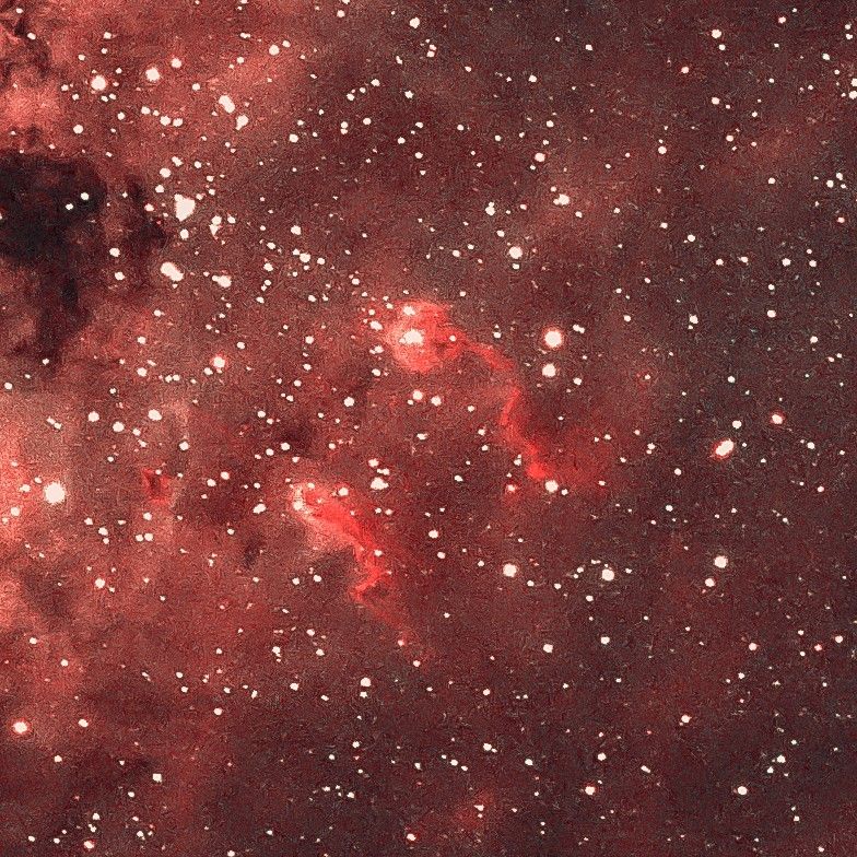 A detail image of the Tadpole Nebula showing two cloudy structures that resemble swimming tadpoles. 