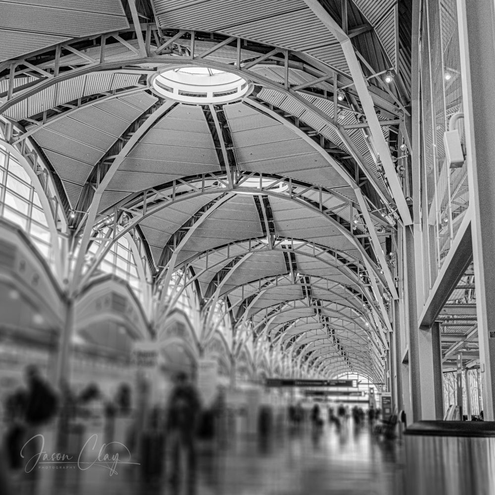 A long corridor at Reagan International airport with repeating architectural details. 