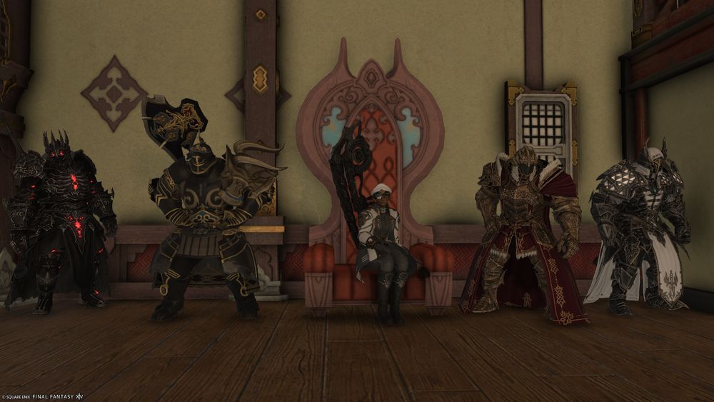 A screenshot of Final Fantasy 14 showing Kisunya sitting on a throne flanked by several sets of armor. Starting from the left they are: Archfiend's Attire, Flame Elite's Fending Attire, Fierce Tyrant's Attire, and the False Monarchy Attire
