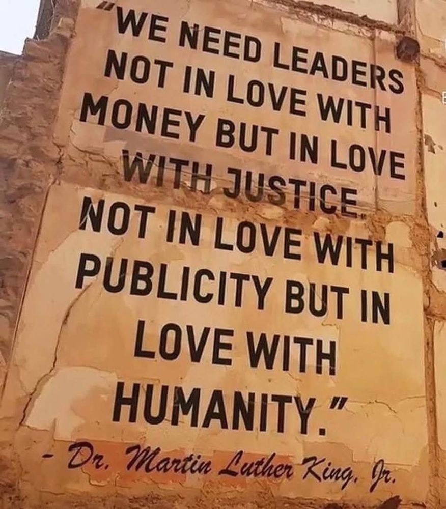 A wall painted with this quote: " We need leaders not in love with money but in love with justice. Not in love with publicity but in love with humanity." - Dr. Martin Luther King Jr.