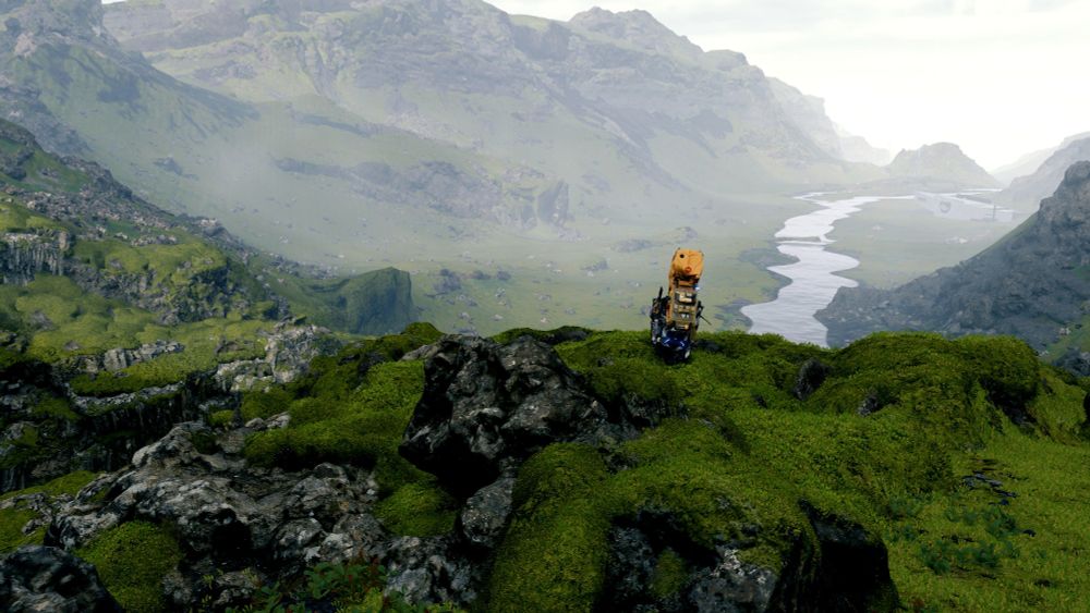 Sam Porter Bridges, carrying cargo for Capitol Knot City, looking over a mossy green landscape and river, wider view.