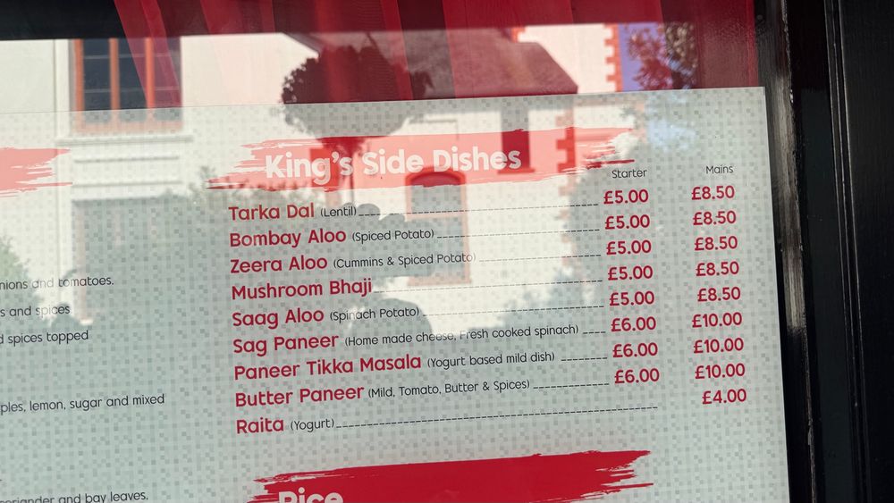A picture of an Indian restaurant menu, where cumin has been misspelled Cummins. 