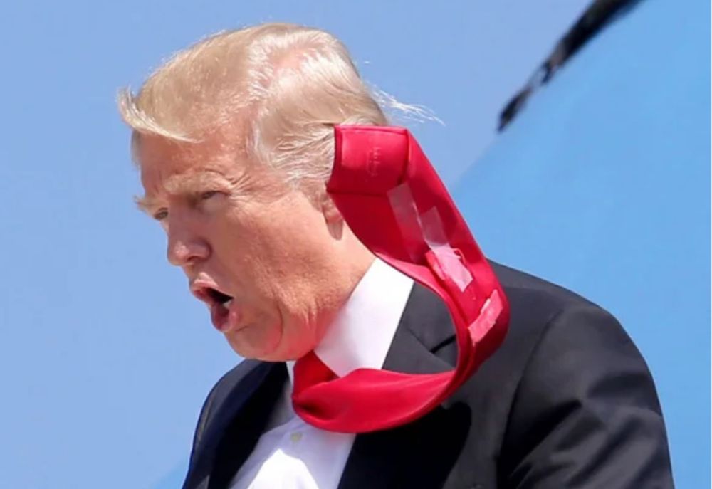 Trump, mouth agape uttering some fatuity, as he exited Air Force One, long red tie flapping in the updraft and revealing sloppy scotch tape strips used instead of a tie tac. 