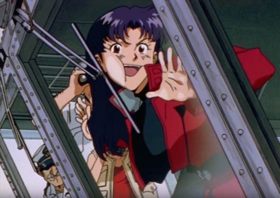 A screenshot from Neon Genesis Evangelion. A character with dark hair is pressed against a window and looking through it with crazed enthusiasm.