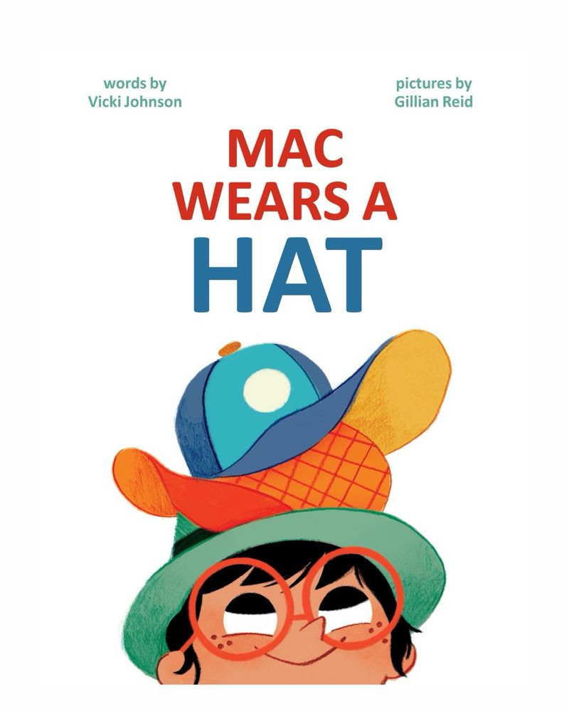 Picture book cover, white background, child’s face w 3 hats on her head, brown skin, freckles, red round glasses and black, short hair. MAC Wears A Hat