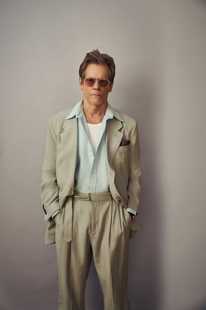 Kevin Bacon in a khaki suit.