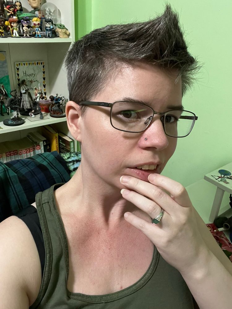 Selfie of trans masc person with glasses