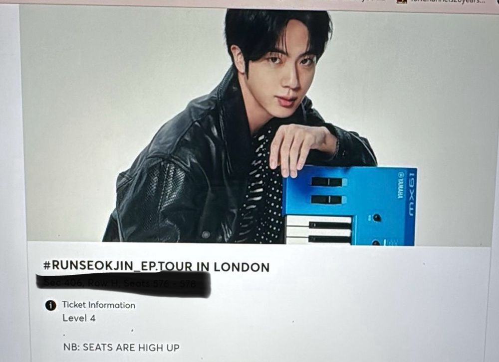 Screenshot of Kim SeokJin over a blue keyboard and a confirmation of tickets 