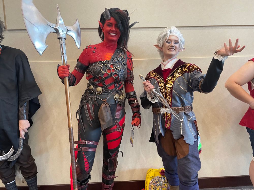 Cosplayers dressed as Karlach and Asterion from Balder’s Gate 3
