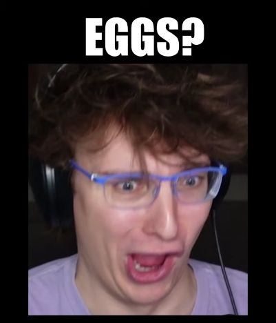 Slimecicle making a silly face, captioned EGGS?