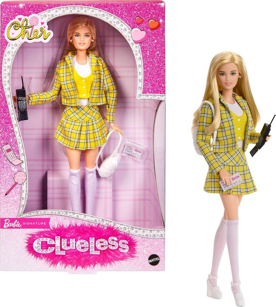 Cher from Clueless as a Barbie doll. She has long blonde hair and is wearing the iconic yellow plaid jacket and skirt with a white shirt and yellow vest. She holds a giant old cell phone from the 90s.