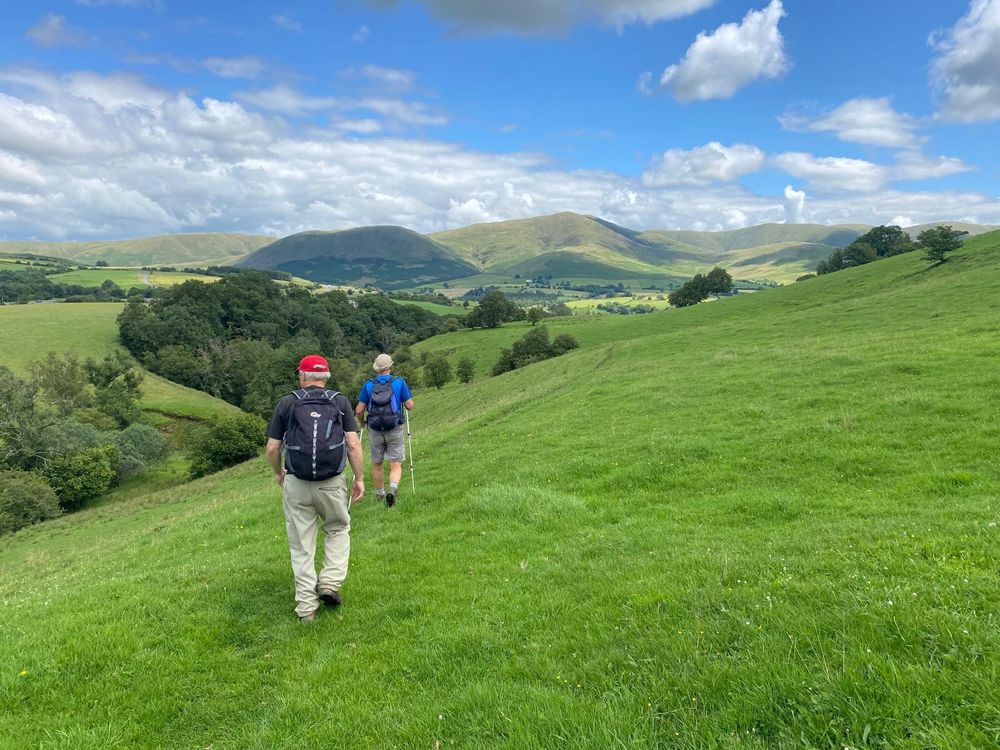 Walking the Dales Way with the Howgill Fells ahead. 