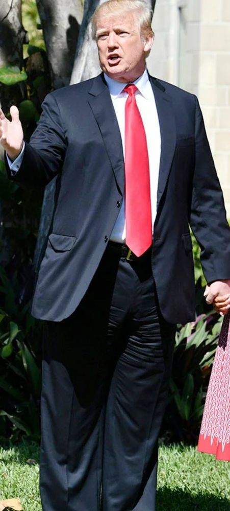 Old orange what’s his face, wear a suit that is terribly wrinkled and the pants are absurdly wide. Which is a sad effort to cover up his fupa. 