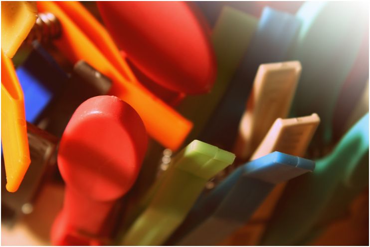 Close up photo of colourful clothes pegs
