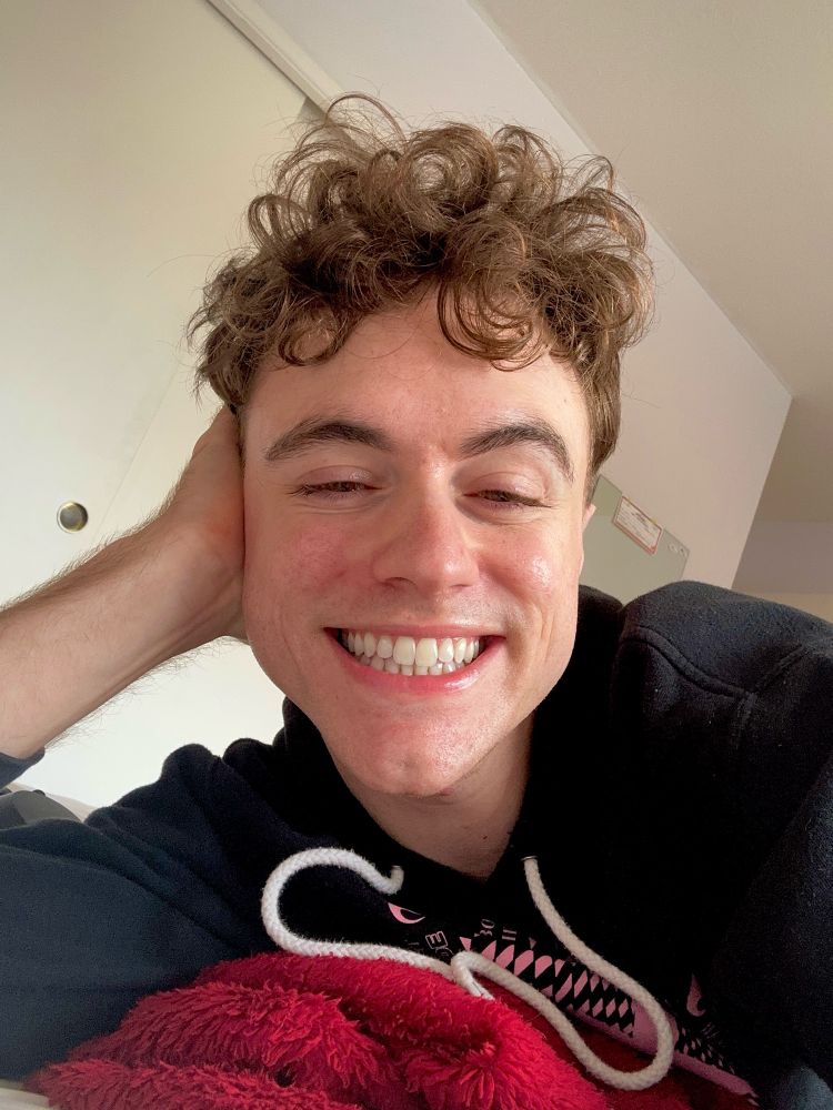 Twink with a strong chin and jaw smiling on his day off