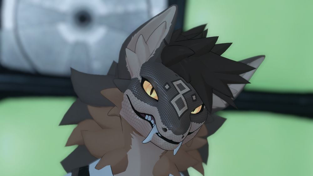 Headshot of the nightstalker kitbash taken in front of several green monitors with one in the top left displaying a test screen. World is Snowbound by Taggynn.