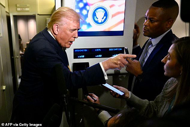 Trump demented finger pointing at Catherine Lucey.