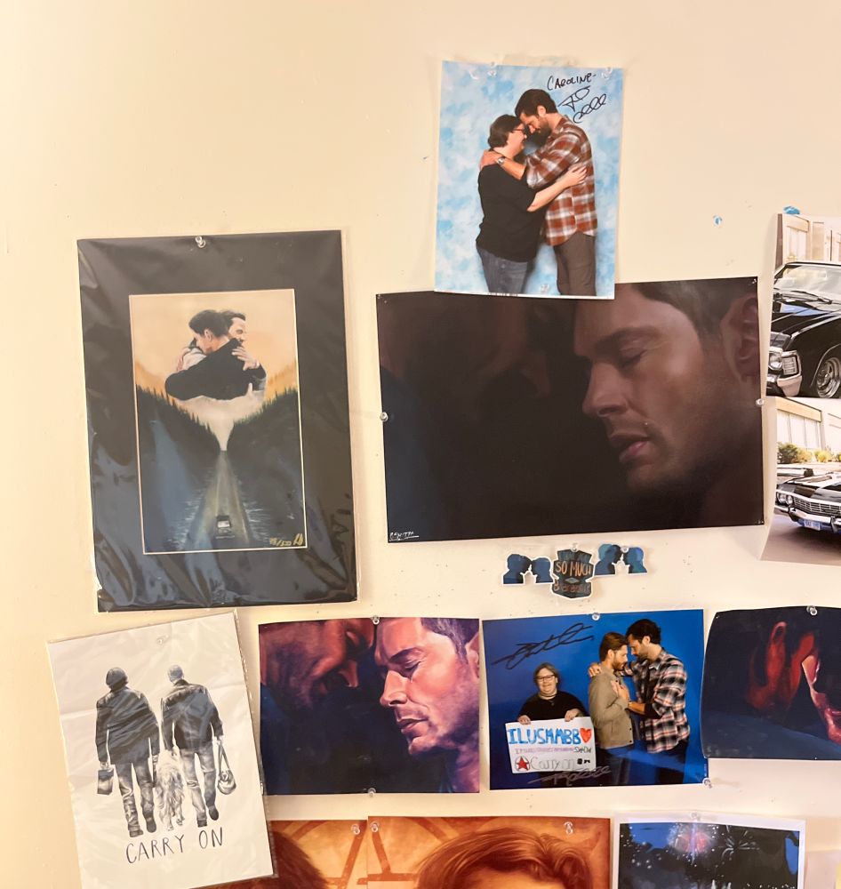  A wall of various Supernatural  themed artworks and photo ops 
