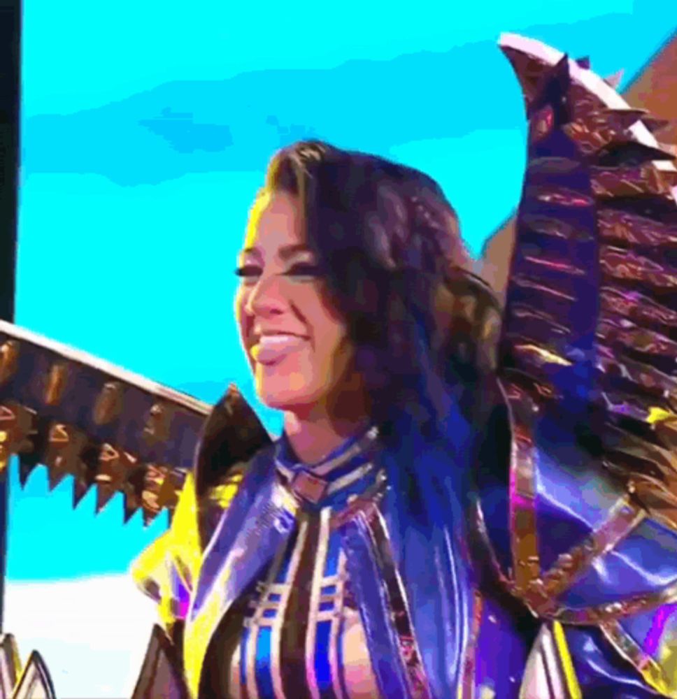 a woman with blue hair is wearing a costume with wings