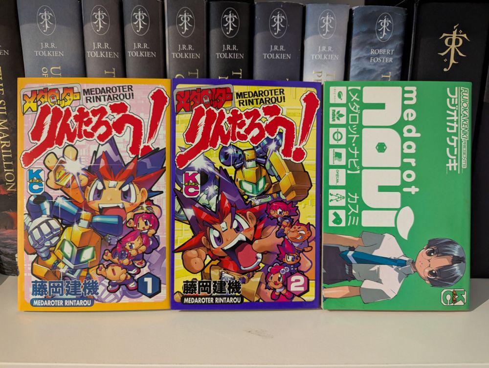 A picture of both volumes of Medaroter Rintarou! and a volume of Medarot Navi. 
