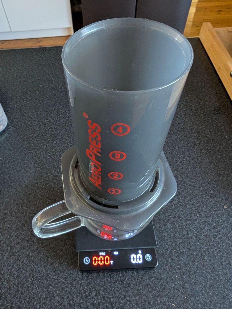 Aeropress on top of a glass mug on the coffee scales